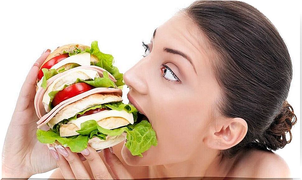 woman devouring sandwich