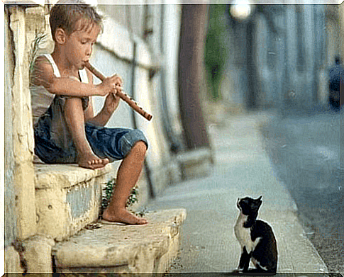 boy playing music for health