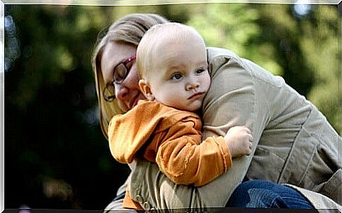 mother hugging autistic child