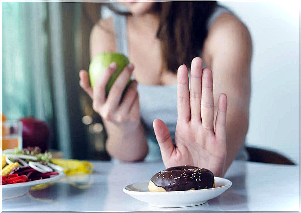 woman rejecting candy