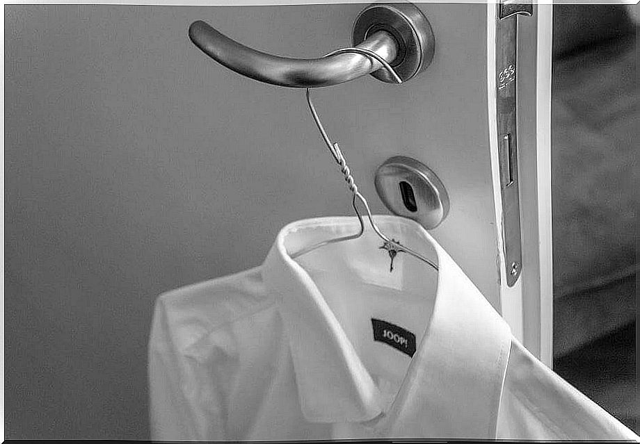 White shirt hanging on the door